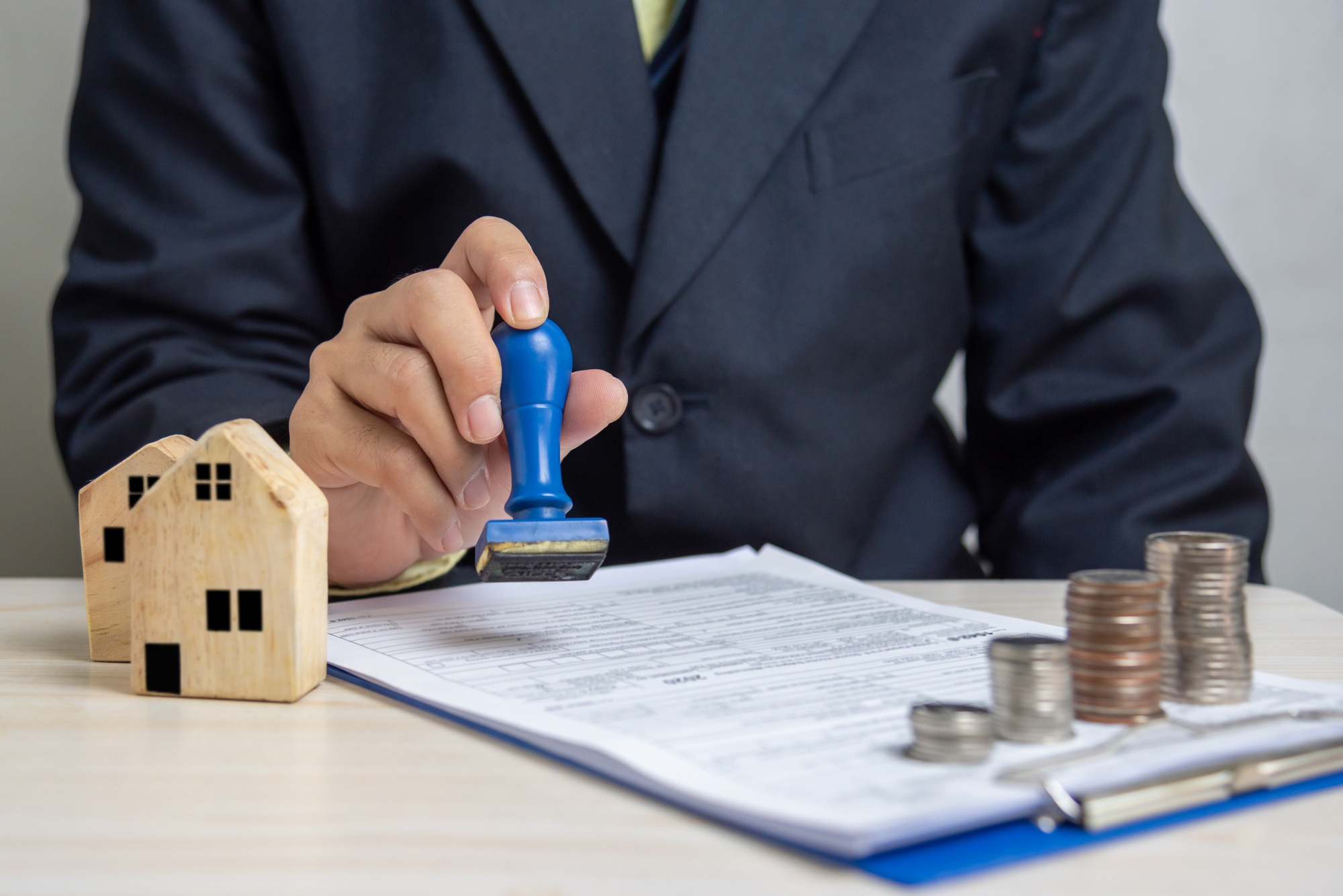 Buying and selling real estate or borrowing money, bank loans, approved investments.